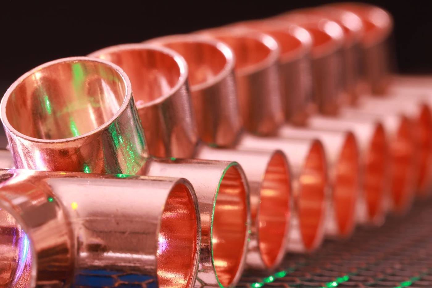 A row of new copper pipe fittings