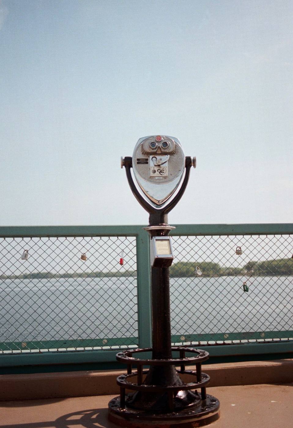A coin-operated viewer on a pier in Erie, looking out over Lake Erie